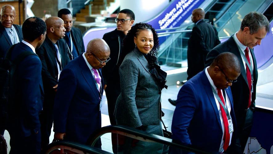 Ministers Pholile Shakantu (Foreign Affairs and International Cooperation) looks on, as Manqoba Khumalo (Commerce Industry and Trade) and Neal Rijkenberg (Finance) go down the escalators while attending the 9th SACU Summit.